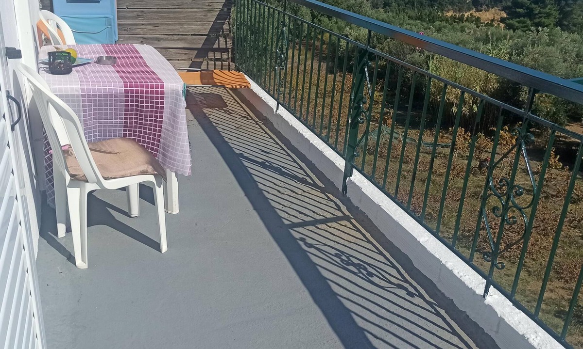 Kompi Apartment | Apartment above Peroulia beach near Koroni - taverna in front of the house