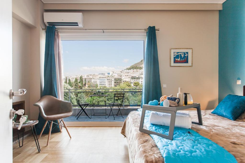 Pangrati Apartment | Central high-class and safe rooms next to Metro Airport Line with Acropolis View from balcony