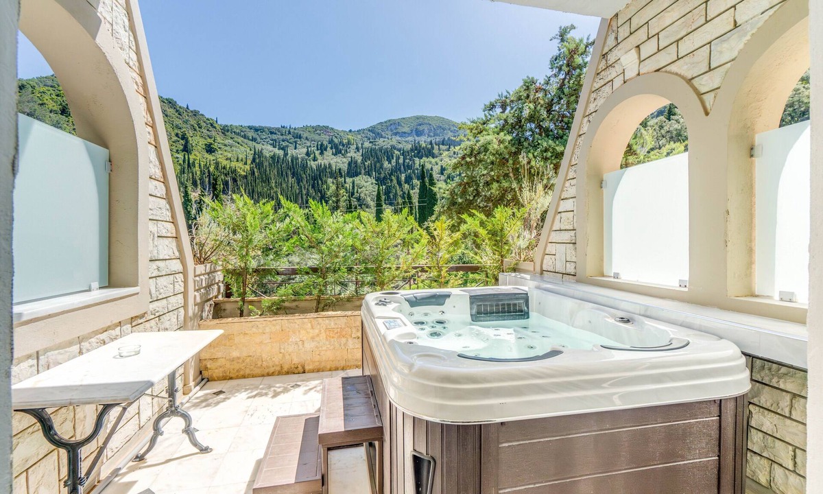 Agios Gordios Apartment | Doliva Anthi Apartment with Private Hot Tub, Mountain View, Wi-Fi, and Air Conditioning