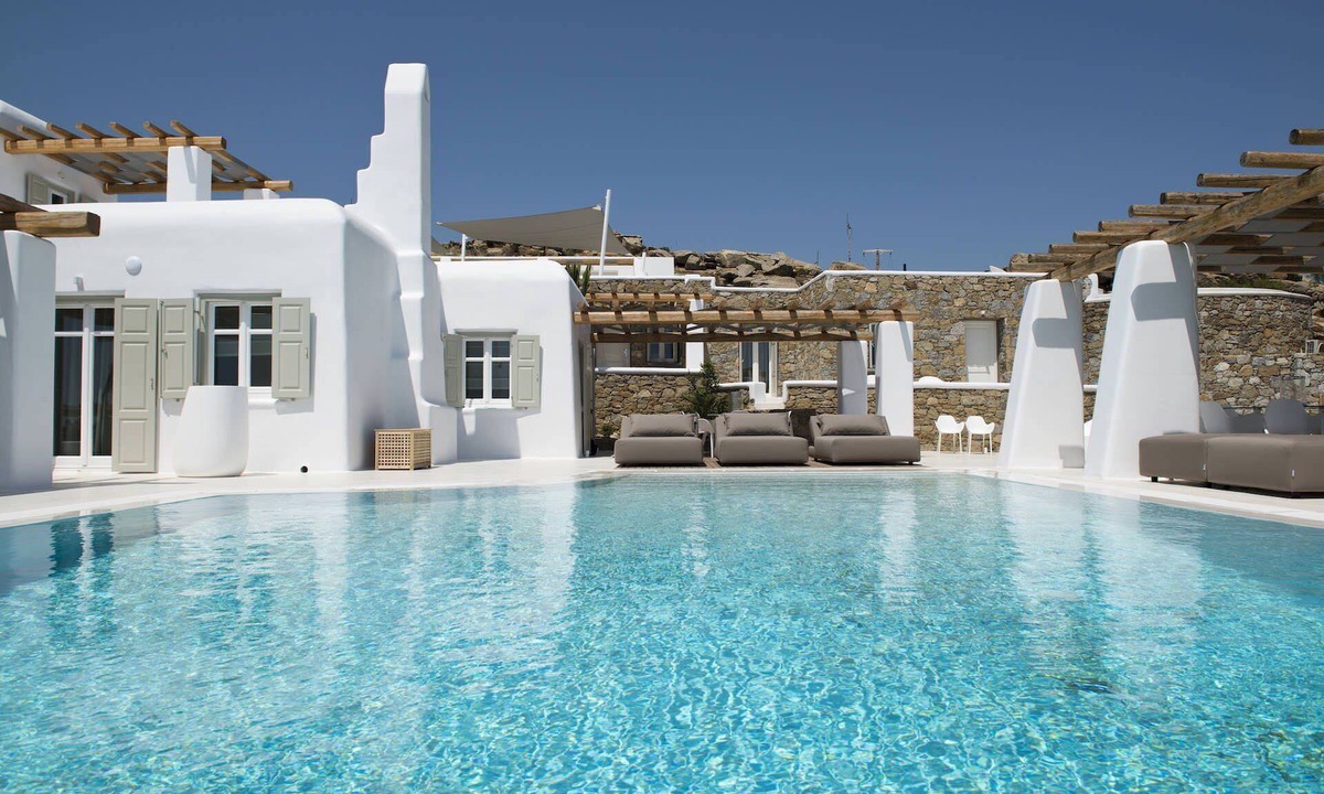 Tourlos Villa | My Rental Homes - Villa Opallia with spacious living and dining areas and a pool