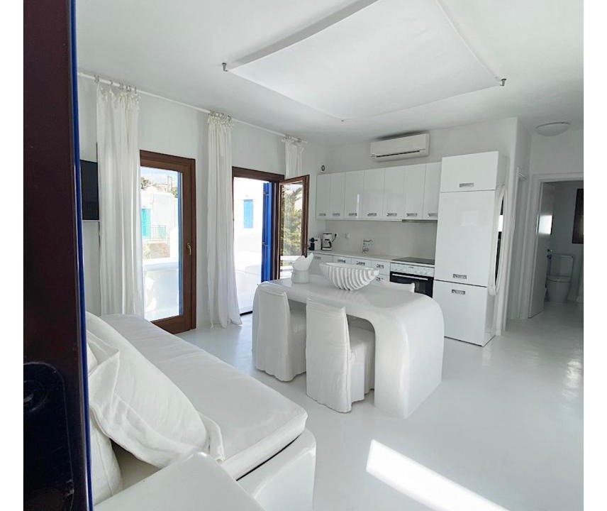 Mykonos Apartment | White luxury suite with shared pool downtown by Mykonos Eight