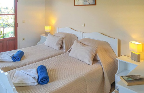 Longos Apartment | A charming apartment perched on the hillside above Loggos offering both easy access to the village a