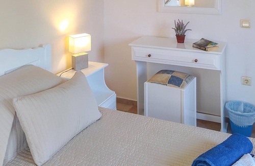Longos Apartment | A charming apartment perched on the hillside above Loggos offering both easy access to the village a