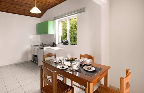 Barbati Apartment | Apartment with sea views in complex with pool and restaurant.