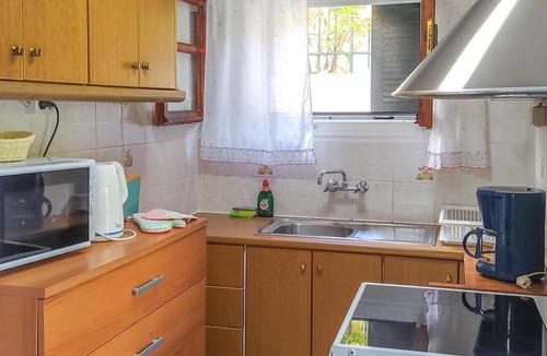Longos Apartment | A charming apartment perched on the hillside above Loggos offering both easy access to the village a
