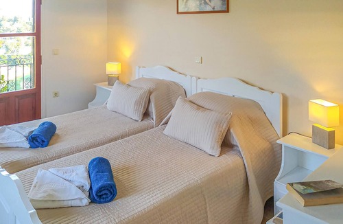 Longos Apartment | A charming apartment perched on the hillside above Loggos offering both easy access to the village a