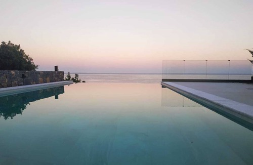 Pefki Villa | An exquisite and luminous seaside villa. The epitome of coastal serenity.