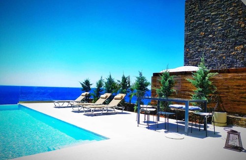 Pefki Villa | An exquisite and luminous seaside villa. The epitome of coastal serenity.