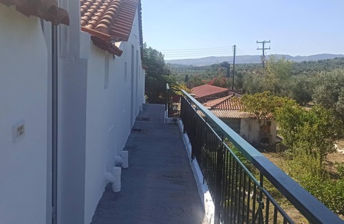 Kompi Apartment | Apartment above Peroulia beach near Koroni - taverna in front of the house