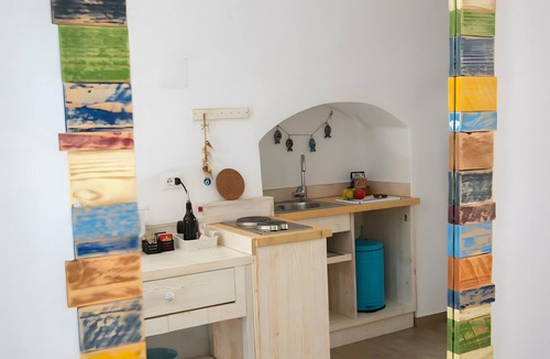 Kamari Apartment | Apartment in A Hotel 'Fireplace' with Wi-Fi and Air Conditioning
