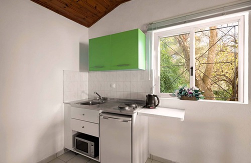 Barbati Apartment | Apartment with sea views in complex with pool and restaurant.