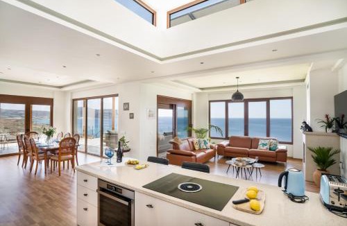 Goudhouros Villa | Beachfront Villa Atalandia with Heated Pool, Gym, BBQ & Office