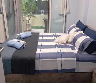 Irakleio Apartment | Ηome & Garden with parking close to Olympic Stadium