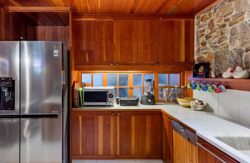Daskalio Villa | Idyllic stone and wood villa with stunning, panoramic views of the Aegean Sea