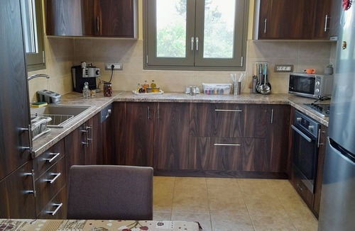 Melidoni Villa | LUXURY VILLA KASTANIA WITH PRIVATE POOL SURROUNDED BY TREES, FLOWERS AND HERBS.