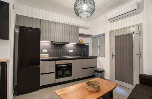 Vivlos Apartment | Næxon Vivlos Grey Roof Apartment with Shared Terrace, Wi-Fi and Air Conditioning