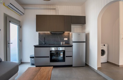 Vivlos Apartment | Naexon Vivlos Stone Escape Apartment with Shared Rooftop, Wi-Fi, and Air Conditioning