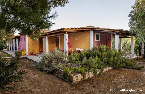 Vasilikos Cottage | Self catered cottage with large veranda and garden with hammock near the beach.