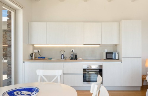 Ios Villa | Stemma is a charming stone villa nestled on a hillside above Mylopotas