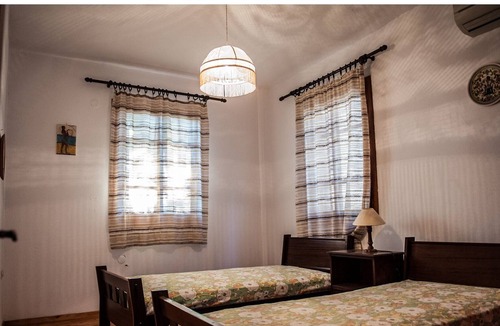 Paleros Villa | Traditional, rustic, seafront villa, just steps away from the beach.