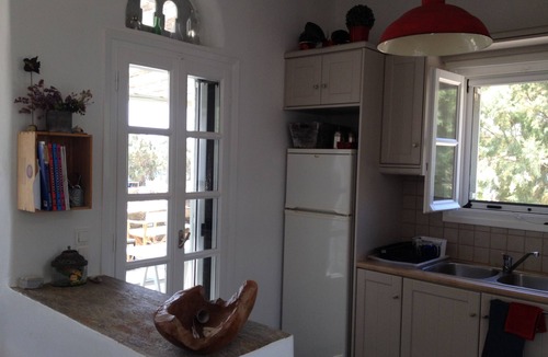 Exomvourgo House | Villa Elia - The charm of Tiniote architecture feet in the water!