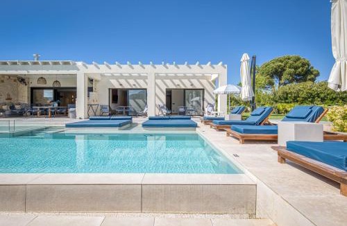 Almiros Beach Villa | Villa Serenissima - Beachfront Villa with Indoor & Outdoor Pools and Gym by Posarelli Villas