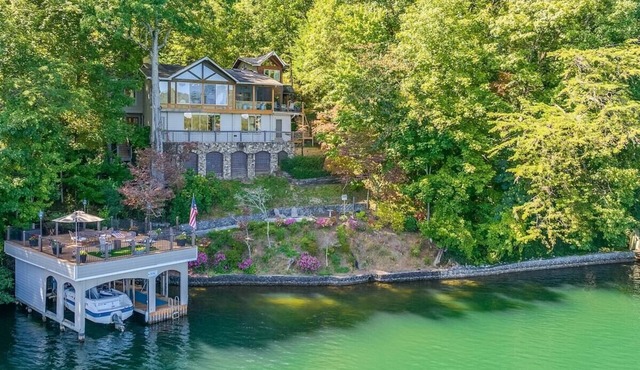 Luxury 5BR Lake Burton home with dock, game room, and lakeside views. in Clarkesville