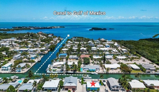 Oasis Canal-Front Home: Pool, Dock, BBQ, Wide Canal Boat Access, and more! in Marathon