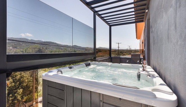 Three-Bedroom Apartment with Balcony, Hot Tub, Wi-Fi, and Air Conditioning
