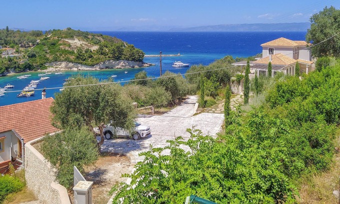 Longos Apartment | A charming apartment perched on the hillside above Loggos offering both easy access to the village a