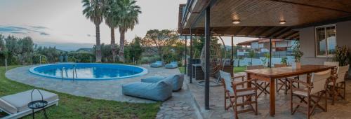 Kalyvia Thorikou House | Cuervo Poolside Villa